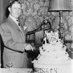 George Casey cuts the cake celebrating the 40th anniversary of United Parcel Service. Photo courtesy of UPS archives.